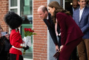 BOSTON, MASSACHUSETTS - DECEMBER 01: Prince William, Prince of Wales and Catherine, Princess of Wales meet a boy dressed as a guard at Greentown Labs, North America’s largest clean-tech incubator, on December 01, 2022 in Boston, Massachusetts. The Prince and Princess of Wales are visiting the coastal city of Boston to attend the second annual Earthshot Prize Awards Ceremony, an event which celebrates those whose work is helping to repair the planet. During their trip, which will last for three days, the royal couple will learn about the environmental challenges Boston faces as well as meeting those who are combating the effects of climate change in the area. (Photo by Samir Hussein/WireImage)