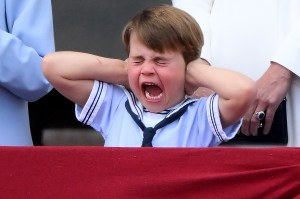 Britain's Prince Louis of Cambridge reacts as he watches a special flypast from Buckingham Palace balcony following the Queen's Birthday Parade, the Trooping the Colour, as part of Queen Elizabeth II's platinum jubilee celebrations, in London on June 2, 2022. Huge crowds converged on central London in bright sunshine on Thursday for the start of four days of public events to mark Queen Elizabeth II's historic Platinum Jubilee, in what could be the last major public event of her long reign. (Photo by Daniel LEAL / AFP) (Photo by DANIEL LEAL/AFP via Getty Images)