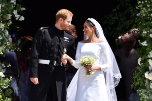 WINDSOR, UNITED KINGDOM - MAY 19: Britain's Prince Harry, Duke of Sussex and his wife Meghan, Duchess of Sussex leave from the West Door of St George's Chapel, Windsor Castle, in Windsor on May 19, 2018 in Windsor, England. (Photo by  Ben STANSALL - WPA Pool/Getty Images)