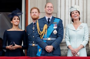 LONDON, UNITED KINGDOM - JULY 10: (EMBARGOED FOR PUBLICATION IN UK NEWSPAPERS UNTIL 24 HOURS AFTER CREATE DATE AND TIME) Meghan, Duchess of Sussex, Prince Harry, Duke of Sussex, Prince William, Duke of Cambridge and Catherine, Duchess of Cambridge watch a flypast to mark the centenary of the Royal Air Force from the balcony of Buckingham Palace on July 10, 2018 in London, England. The 100th birthday of the RAF, which was founded on on 1 April 1918, was marked with a centenary parade with the presentation of a new Queen's Colour and flypast of 100 aircraft over Buckingham Palace. (Photo by Max Mumby/Indigo/Getty Images)