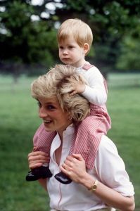 TETBURY, UNITED KINGDOM - JULY 18:  Princess Diana Carries Prince Henry (harry) On Her Shoulders At Highgrove.  (Photo by Tim Graham Photo Library via Getty Images)