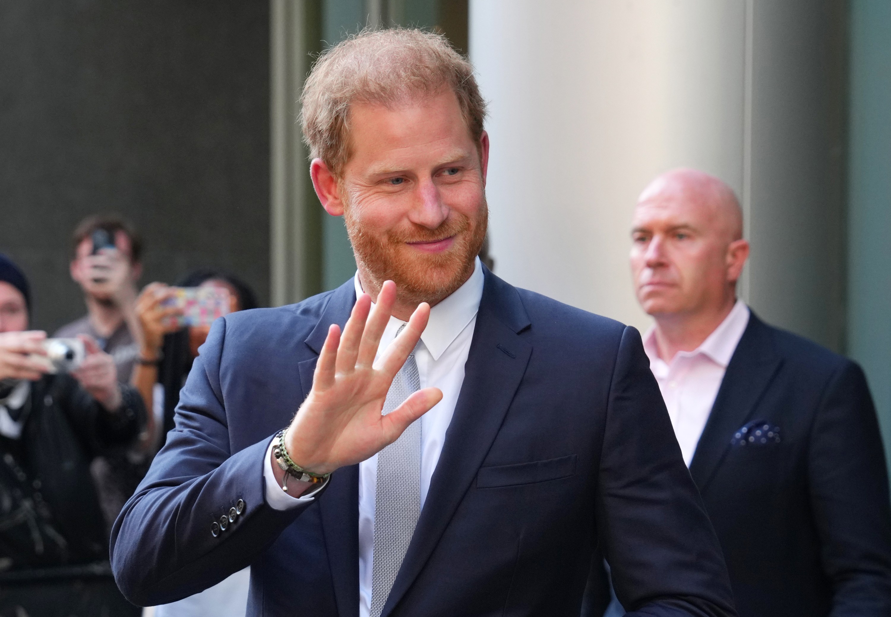 Prince Harry, Duke of Sussex, waves as he leaves after giving evidence at the Mirror Group Phone hacking trial at the Rolls Building at High Court on June 7, 2023 in London, England.