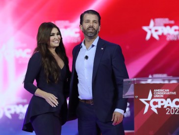 Don Trump, Jr. and Kimberly Guilfoyle stand on stage as they address the Conservative Political Action Conference being held in the Hyatt Regency on February 26, 2021 in Orlando, Florida.