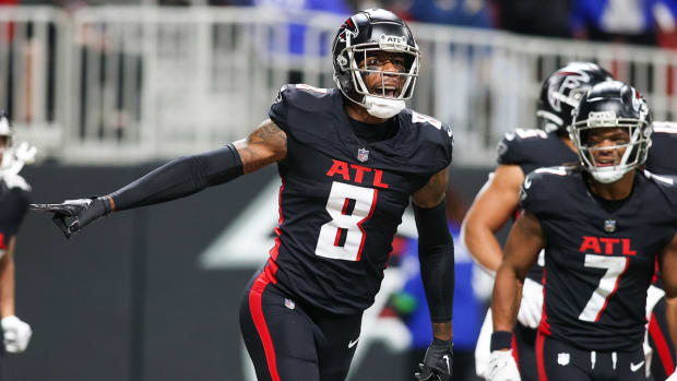 Falcons tight end Kyle Pitts (8) celebrates after a touchdown against the Tampa Bay Buccaneers in the first half at Mercedes-Benz Stadium.