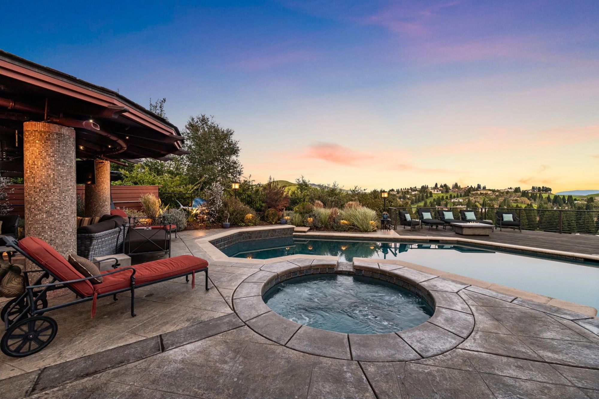 Pool and spa overlooking hills.