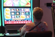 Atlantic City executives are concerned over the threat potential casinos in NYC and the Meadowlands, N.J. may pose. This file photo from Sept. 29, 2023, shows a gambler playing a slot machine at Harrah's casino in Atlantic City N.J. (Associated Press/Wayne Parry)