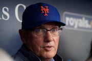 New York Mets owner Steve Cohen talks to the media in the dugout before a baseball game against the Kansas City Royals Wednesday, Aug. 2, 2023, in Kansas City, Mo. (AP Photo/Charlie Riedel)