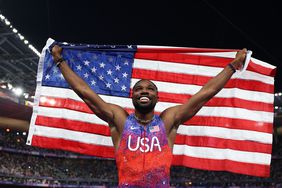 Noah Lyles of Team United States celebrates winning the gold medal after competing the Men's 100m Final on day nine of the Olympic Games Paris 2024 at Stade de France on August 04, 2024 in Paris