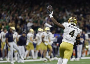 Jan 2, 2025; New Orleans, LA, USA; Notre Dame Fighting Irish linebacker Jaiden Ausberry (4) celebrates after recovering a fumble against the Georgia Bulldogs during the first quarter at Caesars Superdome. Mandatory Credit: Geoff Burke-Imagn Images