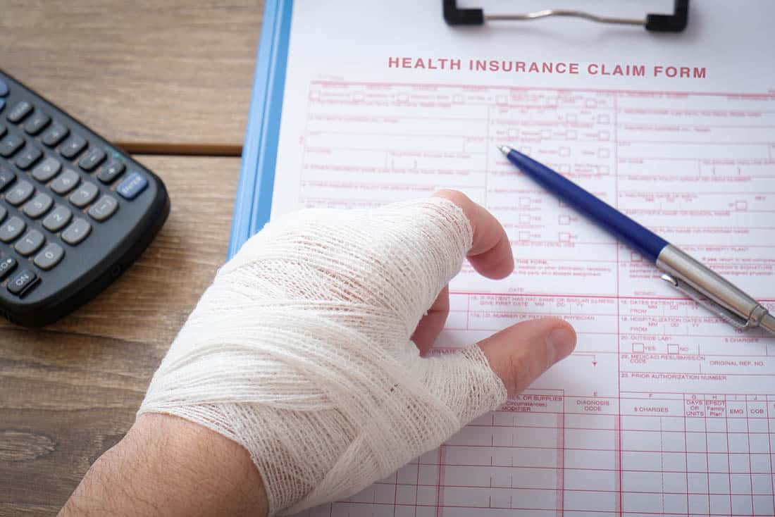 injured man with broken arm photo