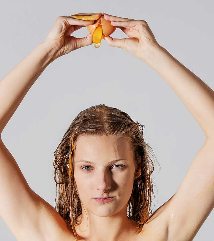 Women Applying Eggs On Hair