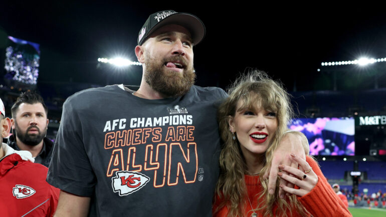 Travis Kelce #87 of the Kansas City Chiefs celebrates with Taylor Swift after a 17-10 victory against the Baltimore Ravens in the AFC Championship Game