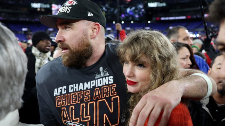 Travis Kelce and Taylor Swift on the field after the 2024 AFC Championship game