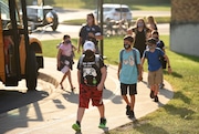 Students arrive at Jordan-Elbridge Middle School Wednesday, Sept. 9, 2020, for the second day of school. This year will be different with mask wearing, desks spaced out in classrooms and other safety protocols in place to help keep students and staff safe from the coronavirus. Lauren Long | llong@syracuse.com