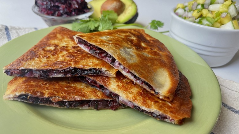 stacked hibiscus quesadillas on plate