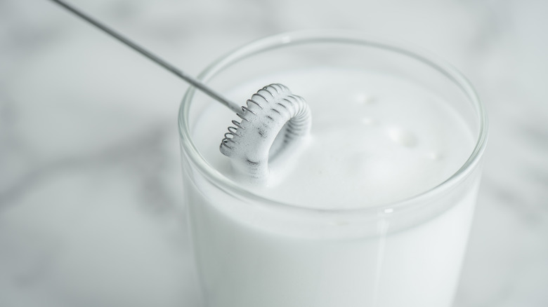 frothed milk with handheld frother