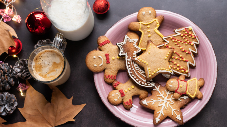 Plate of gingerbread cookies with coffee and milk