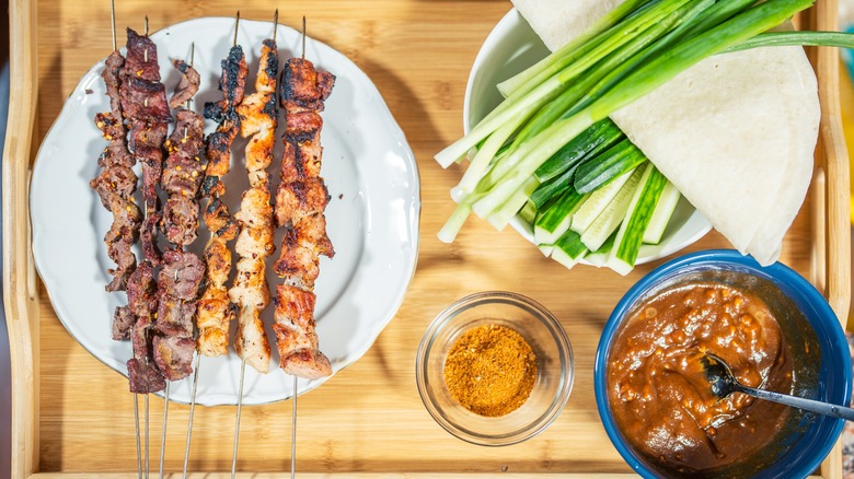 meat skewers with chives and sauce