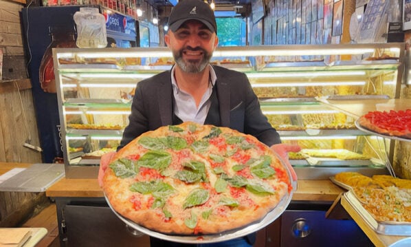 Man holding pizza