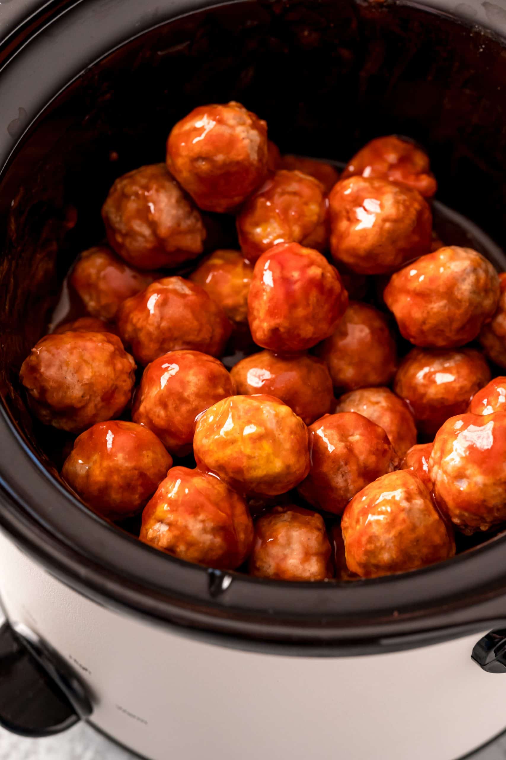 Finished meatballs in crock pot stirred up