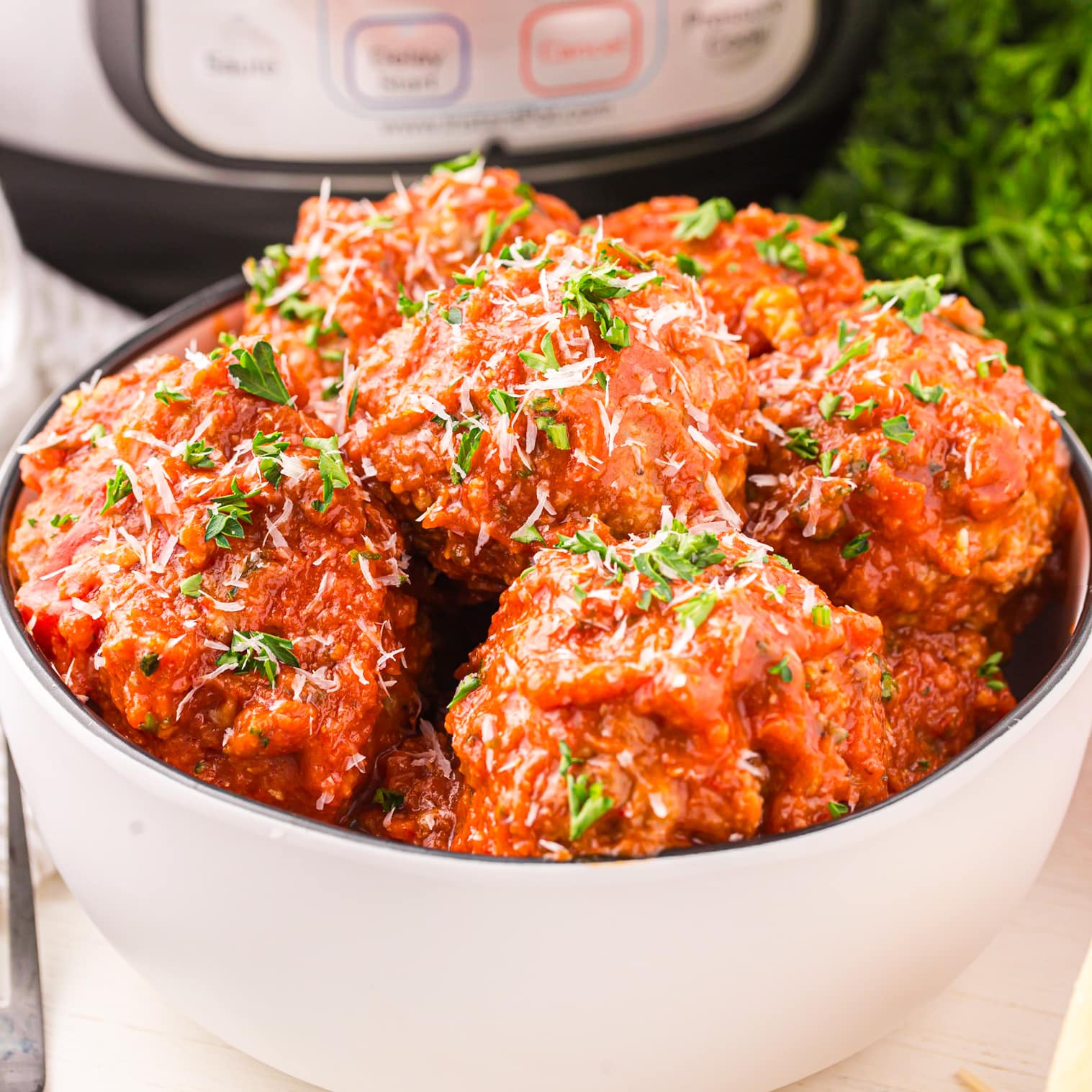 A white bowl of Instant Pot Meatballs.