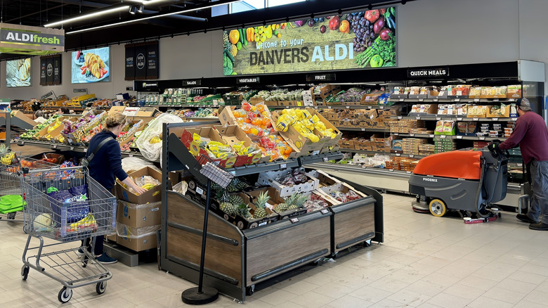 Woman shopping in produce section of Aldi