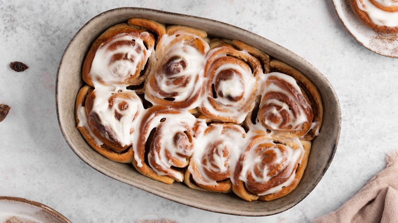 Baked cinnamon rolls in a beautiful dish.