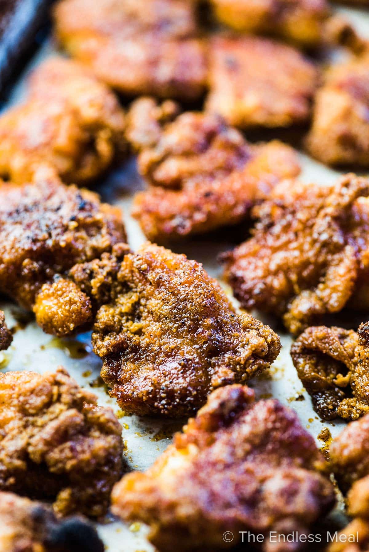 A close up of easy chicken bites on a baking sheet. 