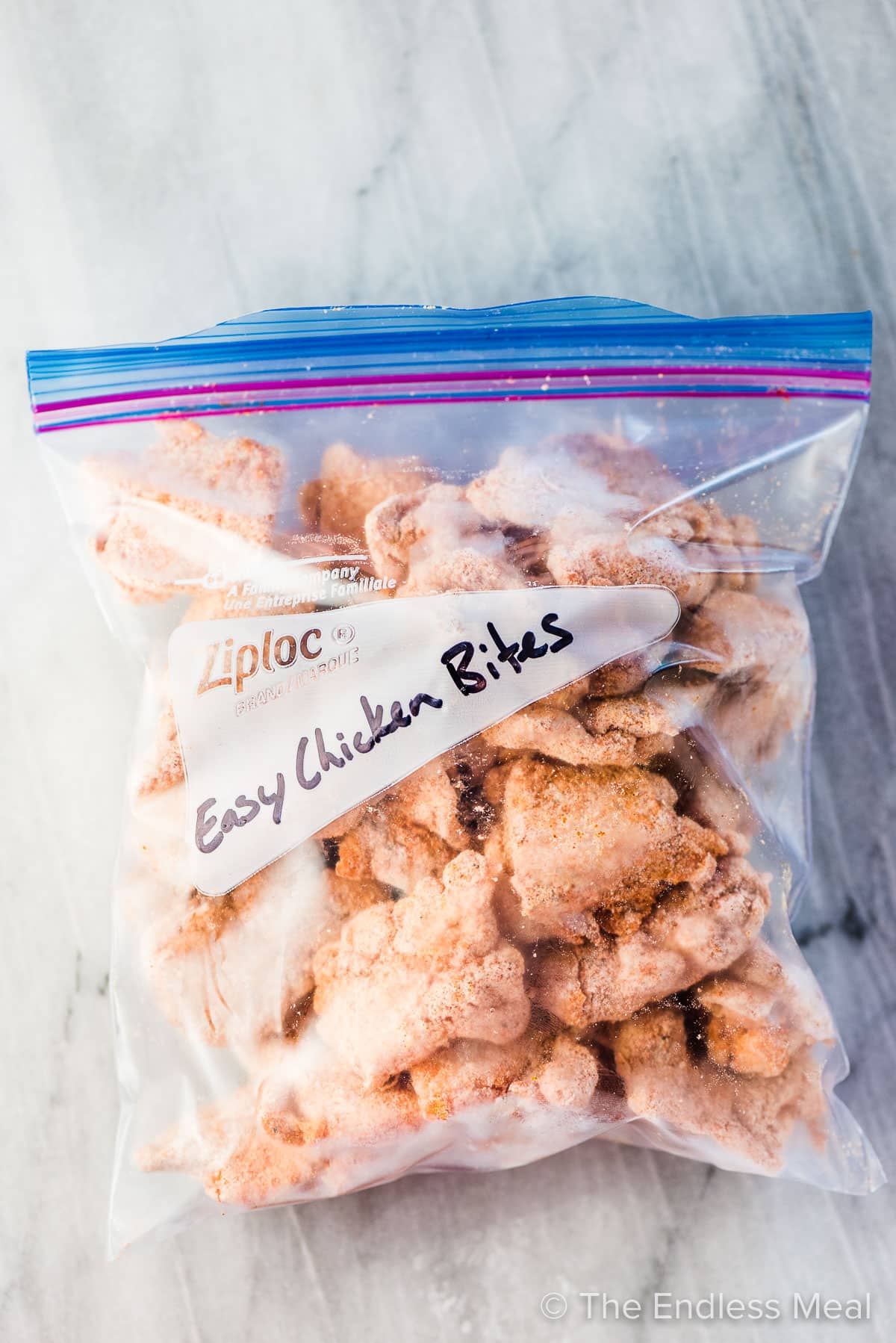 A bag filled with frozen easy chicken bites.