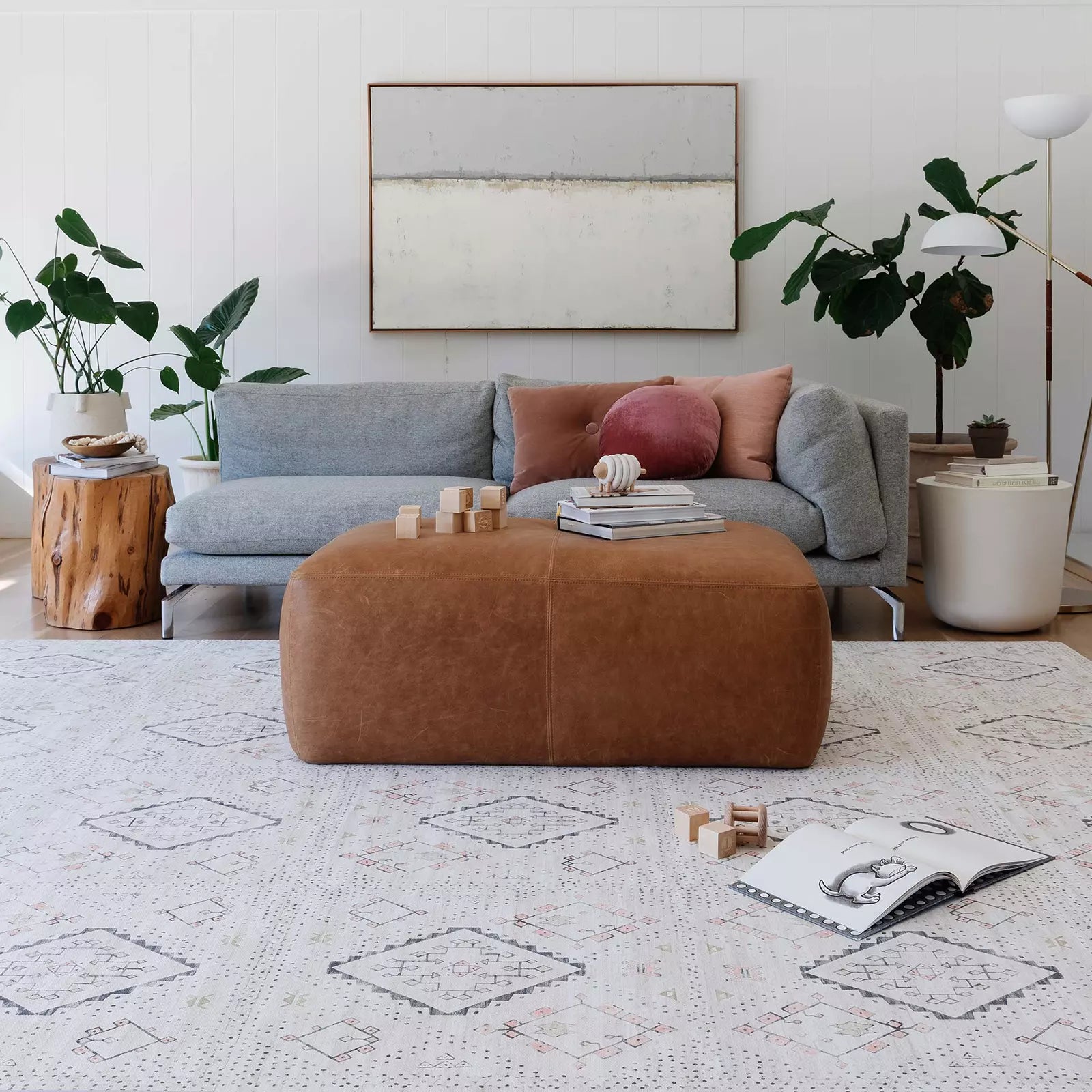 Ula Oat Neutral Boho Pattern play mat in living room with toys and books laid out on the mat