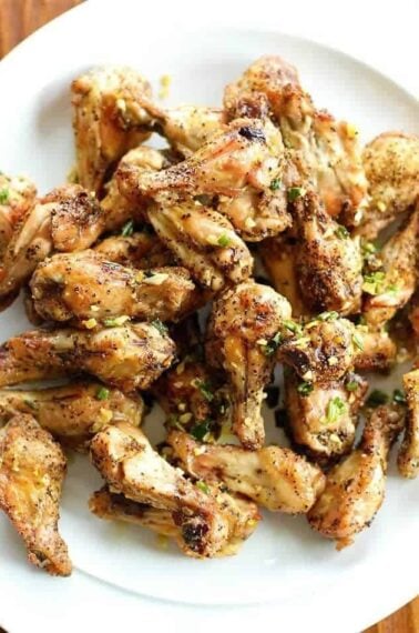 Close up of Salt and Pepper Chicken Wings with Garlic Oil Over the Top