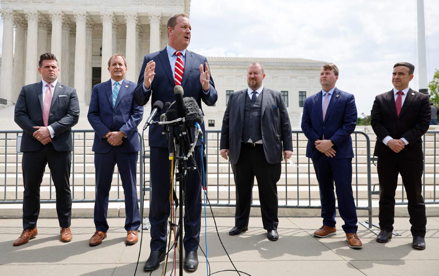 Missouri Attorney General Eric Schmitt (C) talks to reporters with Texas Attorney General Ken Paxton (2nd L), both active members of the Republican Attorneys General Association.