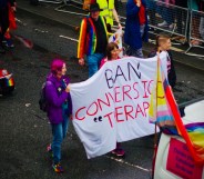 People carrying "Ban Conversion Therapy" banner at Brighton Pride Parade