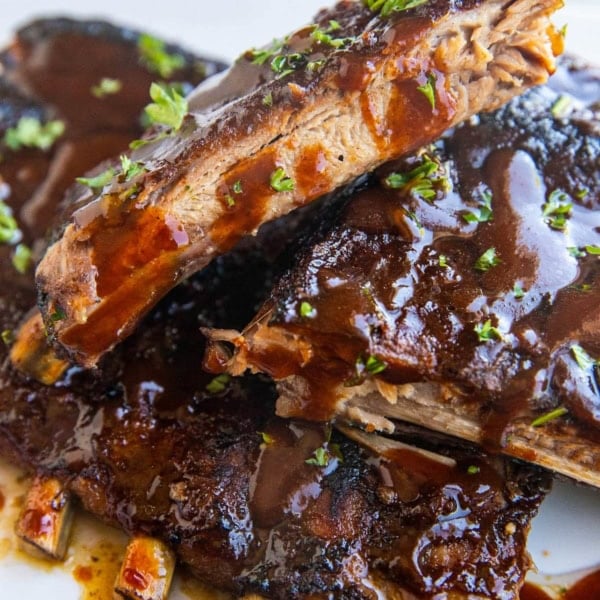 Stack of barbecue baked ribs on a platter