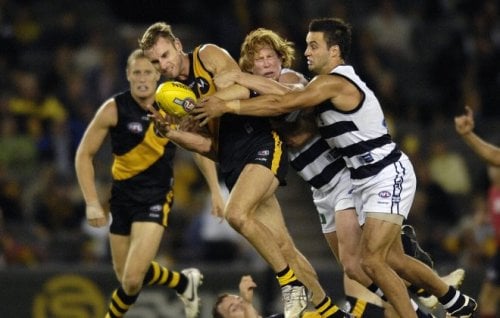 Richmond’s Shane Tuck is tackled during an AFL match in 2007. 