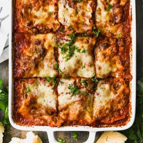 Square overhead shot of a dish of homemade lasagna.