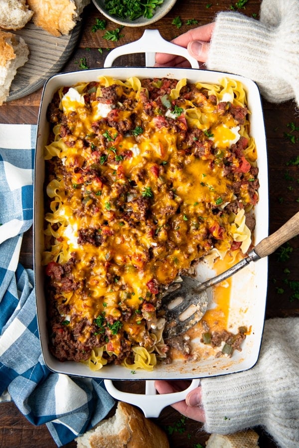 Overhead image of a white baking dish full of sour cream noodle bake.