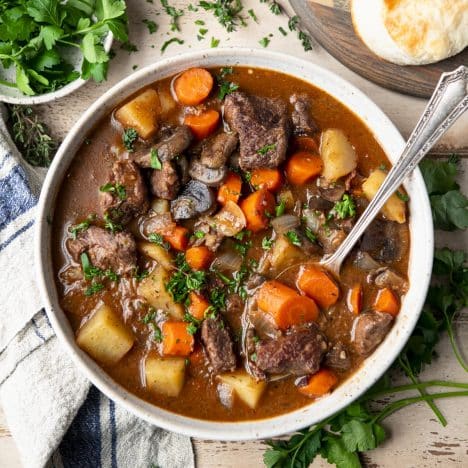 Square overhead shot of a bowl of Dutch oven beef stew.