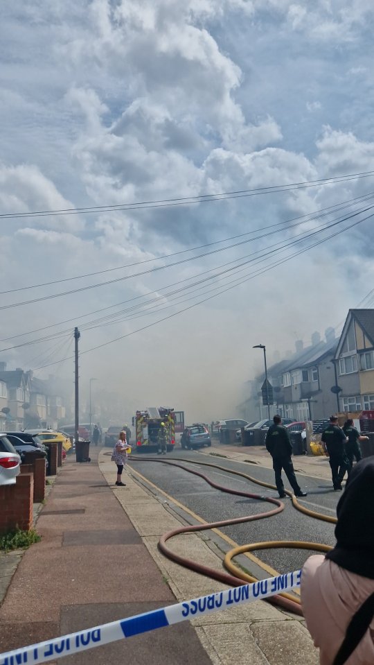 Cops have set up a cordon as panicked residents rush to the streets