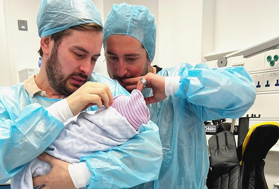 Tearful Brian and Arthur cradle their new baby daughter