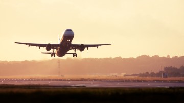 an airplane is taking off from an airport runway