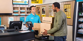 Customer and The UPS Store associate speaking at the counter in store