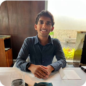 smiling man sitting at desk