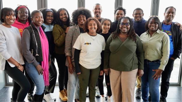 A group photo of Black women leaders from the Black Alliance for Just Immigration, an Immigrants Belong Fund grantee.