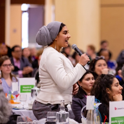 A Muslim woman from LeaderSpring Center, a fiscally sponsored partner of Tides, speaking at a the WOC LeadStrong event.