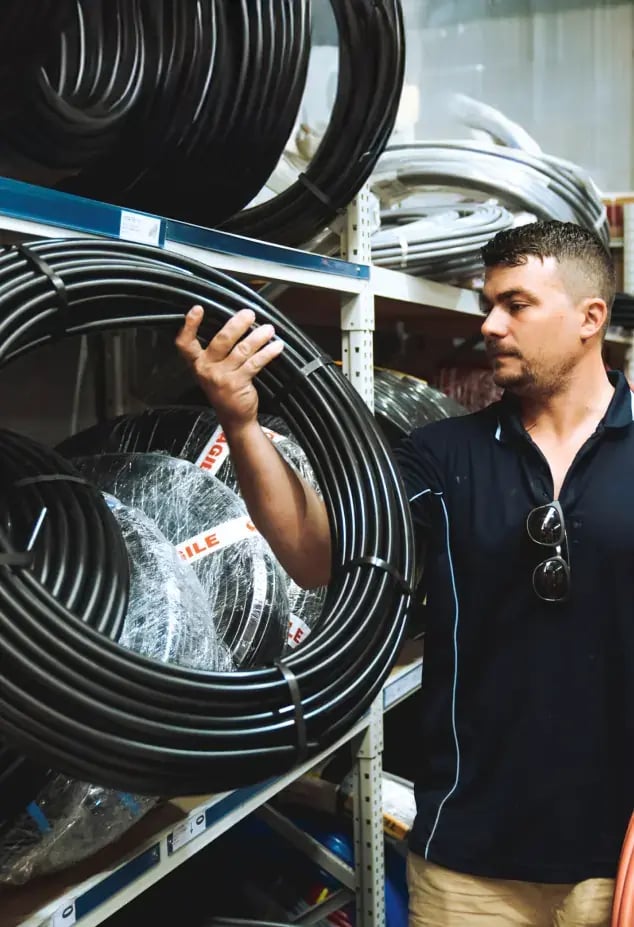 A plumber reviewing products 