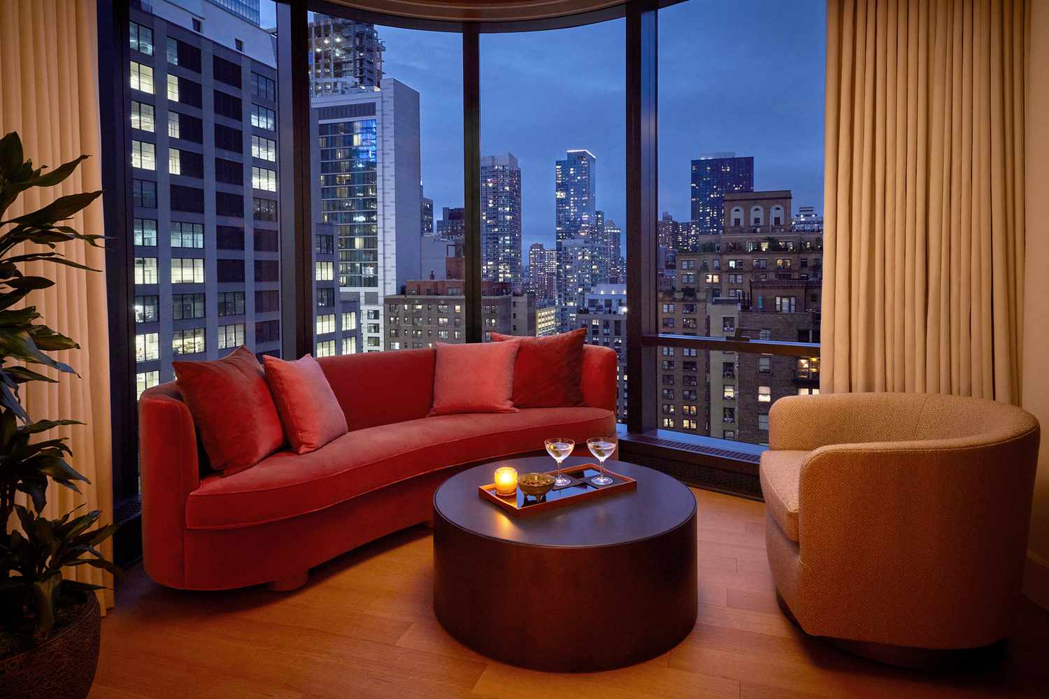 Skyline Corner One Bedroom Suite at night at the Pendry Manhattan West