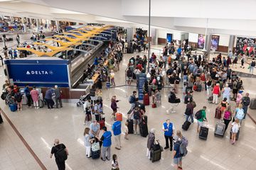 Delta passengers at baggage claim at Atlanta International