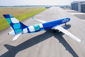 JetBlue Mint Livery aerial on an airport tarmac 