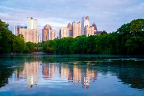 View of lush green trees in Piedmont park during summer at dusk